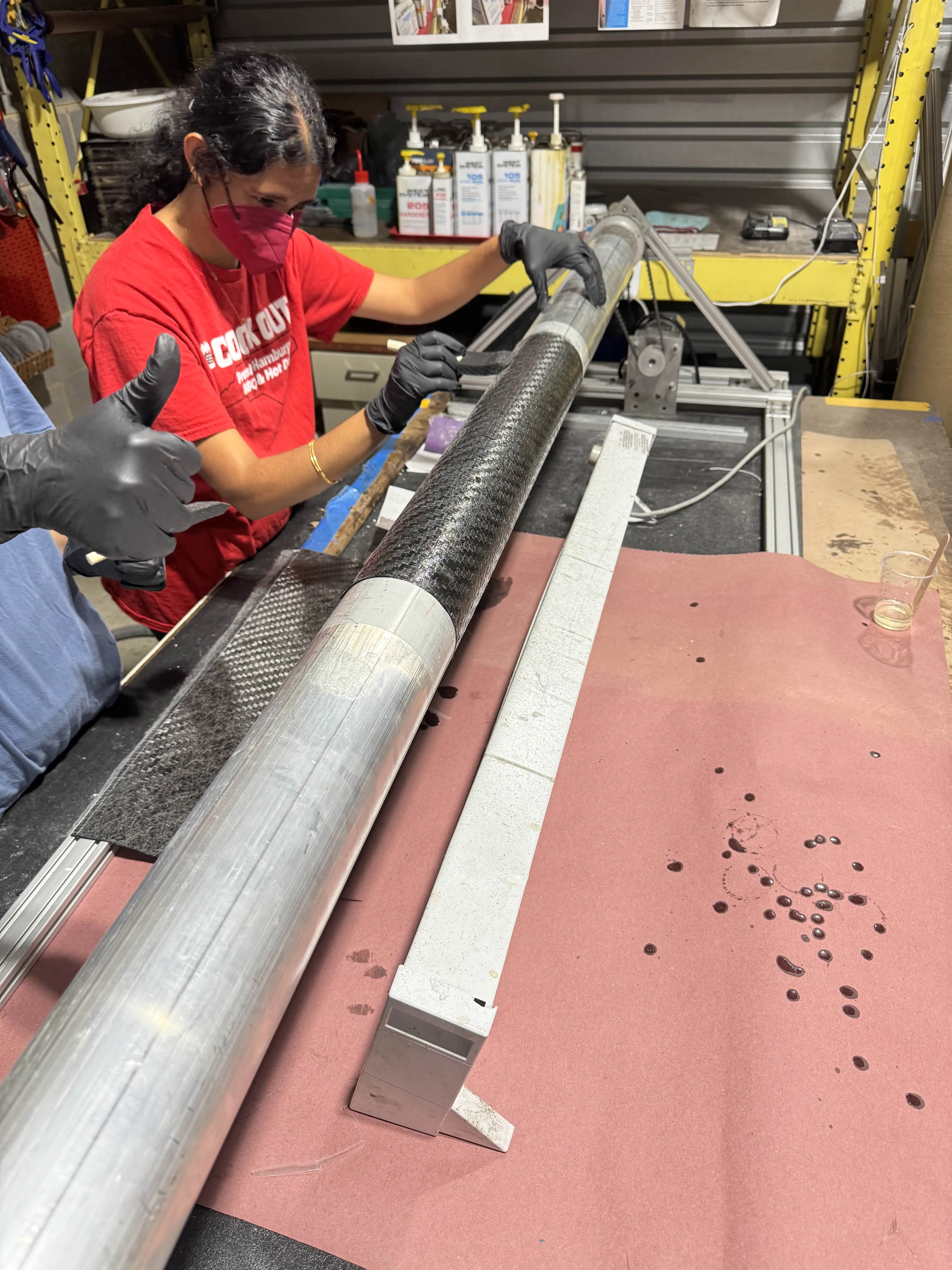 Aerostructures members wrapping a carbon fiber motor tube